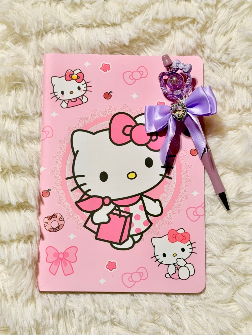 Hello Kitty Pink Notebook with Decorative Purple Bow Pen Set